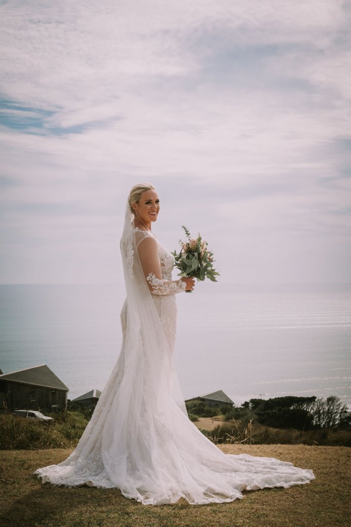 Real Bride Jamielle wearing her Custom Harriett Falvey Wedding Dress and Veil Made in New Zealand